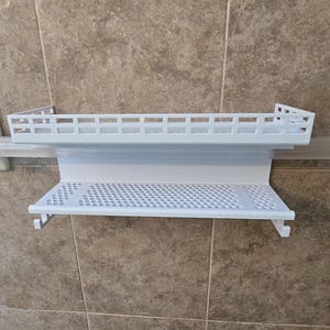 May include: A set of three ceramic mugs with a speckled, matte finish. The mugs are in shades of cream, light gray, and dark gray. Each mug has a simple, minimalist design and a rounded handle. The mugs are suitable for coffee, tea, or other beverages.