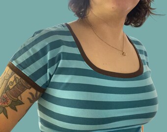 Cap sleeve T-shirt with scoop neck. Size Small and Medium.