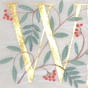 Initial letter painted gold with Rowan and Laurel leaves on silk paper