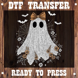 May include: DTF TRANSFER graphic featuring a white ghost with a brown bow, black eyes, and floral accents. The ghost is surrounded by spiderwebs and bats. The text "READY TO PRESS" is at the bottom, with "DTF TRANSFER" at the top.