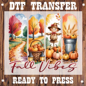 May include: DTF transfer featuring a watercolor design with autumn themes. The design includes a path, trees, pumpkins, a scarecrow, and the text "Fall Vibes" and "Ready to Press". The image is set against a wood grain background.