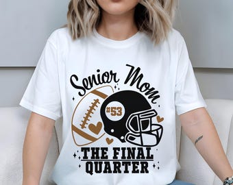 May include: White t-shirt with a football and helmet graphic. The design includes a football, a black helmet with the number 53, and the words "Senior Mom" and "The Final Quarter" in black script.