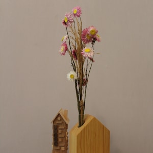 Real dried flower bouquet. Bouquet of dried flowers in a wooden vase.  Natural flower bouquet. Wooden vase