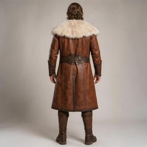 Front and back views of a handmade men’s brown leather Viking coat costume featuring a long medieval warrior design, wide cream fur shoulder collar, lace-up front, metal buckle closures, waist belt, dark leather trim, fitted sleeves, wrist guards, split coat hem, matching brown trousers, and tall leather boots. Rustic fantasy outfit inspired by Norse styles, ideal for Viking cosplay, Renaissance fairs, LARP events, Halloween costumes, stage performances, themed parties, and fantasy photoshoots.