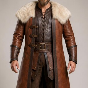 Front and back views of a handmade men’s brown leather Viking coat costume featuring a long medieval warrior design, wide cream fur shoulder collar, lace-up front, metal buckle closures, waist belt, dark leather trim, fitted sleeves, wrist guards, split coat hem, matching brown trousers, and tall leather boots. Rustic fantasy outfit inspired by Norse styles, ideal for Viking cosplay, Renaissance fairs, LARP events, Halloween costumes, stage performances, themed parties, and fantasy photoshoots.