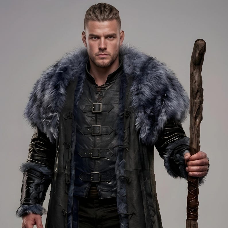 Black leather Viking armor costume with a long fur-trimmed medieval coat, sleeveless inner armor vest, layered leather panels, wide waist belt, fur-trimmed shoulders, long sleeves, adjustable straps, and matching leather leg armor. Rugged Norse-inspired outfit for men, ideal for Halloween, Viking cosplay, LARP, Renaissance fairs, medieval festivals, fantasy conventions, winter events, themed parties, and photoshoots. Handmade with custom sizing and customization options.