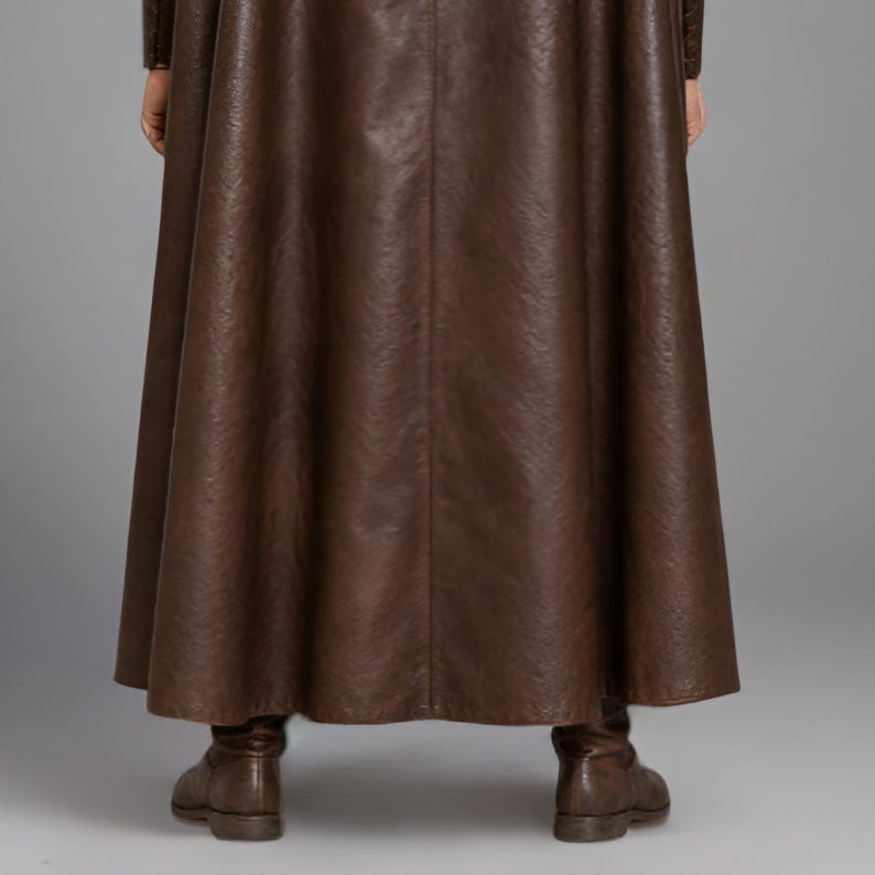 Men’s brown Viking leather tunic with a full-length matching cloak, large light fur shoulder collar, lace-up neckline, wide leather belt, front utility pockets, and matching leather forearm bracers. Front and back views show the sleeveless Norse warrior tunic and long flowing fur-trimmed cloak. Ideal for Viking cosplay, medieval LARP, Renaissance fairs, Halloween, fantasy conventions, stage costumes, and Norse warrior events.