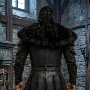 Men’s black Viking leather armor costume with layered chest panels, dramatic black fur shoulder trim, double buckle waist belts, segmented leather battle skirt, matching forearm bracers, and black leg armor. Full front view shows a dark Norse warrior outfit with structured leather detailing and rugged medieval styling. Ideal for Viking cosplay, medieval LARP, Renaissance fairs, Halloween, fantasy conventions, warrior costumes, stage events, and themed photoshoots.
