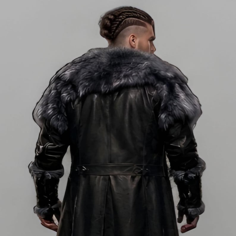 Black leather Viking armor costume with a long fur-trimmed medieval coat, sleeveless inner armor vest, layered leather panels, wide waist belt, fur-trimmed shoulders, long sleeves, adjustable straps, and matching leather leg armor. Rugged Norse-inspired outfit for men, ideal for Halloween, Viking cosplay, LARP, Renaissance fairs, medieval festivals, fantasy conventions, winter events, themed parties, and photoshoots. Handmade with custom sizing and customization options.