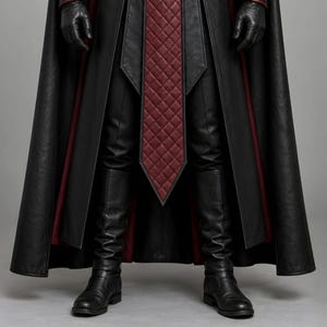 Men’s black and burgundy plague doctor leather costume featuring a long gothic hooded coat, quilted red leather chest panel, fur-trimmed shoulders, lace-up front closure, waist belt, matching leather bracers, gloves, and medieval-style detailing. Front and back views show the full-length dark fantasy coat with red accents, hood, shoulder armor, and flowing silhouette, ideal for Halloween, LARP, gothic cosplay, Renaissance fairs, and medieval fantasy events.