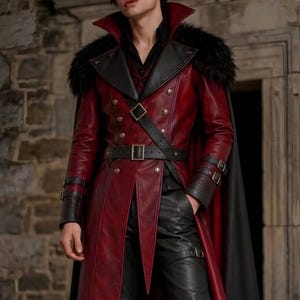 Men’s red and black Gothic vampire leather coat featuring a high standing collar, black fur-trimmed shoulders, double-breasted button detailing, wide waist belt, cross-body leather strap, long sleeves, and a dramatic floor-length silhouette. The dark Victorian-inspired design creates a Vampire Lord look ideal for Halloween, gothic cosplay, LARP, Renaissance fairs, masquerade events, fantasy conventions, stage performances, costume parties, and themed photoshoots.