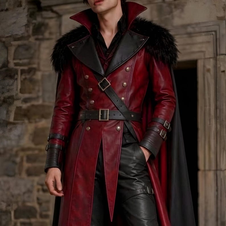 Men’s red and black Gothic vampire leather coat featuring a high standing collar, black fur-trimmed shoulders, double-breasted button detailing, wide waist belt, cross-body leather strap, long sleeves, and a dramatic floor-length silhouette. The dark Victorian-inspired design creates a Vampire Lord look ideal for Halloween, gothic cosplay, LARP, Renaissance fairs, masquerade events, fantasy conventions, stage performances, costume parties, and themed photoshoots.