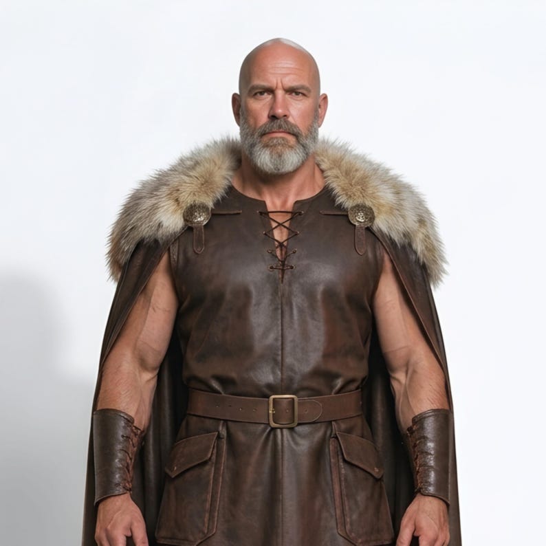 Men’s brown Viking leather tunic with a full-length matching cloak, large light fur shoulder collar, lace-up neckline, wide leather belt, front utility pockets, and matching leather forearm bracers. Front and back views show the sleeveless Norse warrior tunic and long flowing fur-trimmed cloak. Ideal for Viking cosplay, medieval LARP, Renaissance fairs, Halloween, fantasy conventions, stage costumes, and Norse warrior events.