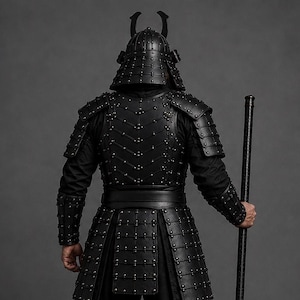 Black samurai armor costume featuring a dark Japanese warrior design with layered leather chest armor, shoulder guards, arm bracers, waist belt, front panels and leg guards. Detailed metal rivets and adjustable straps create a strong medieval LARP and cosplay look. Handmade black leather warrior armor for Halloween, cosplay conventions, Renaissance fairs, photoshoots and fantasy events. Custom sizing is available. Helmet, stick, weapon, footwear and other accessories are not included in photos.