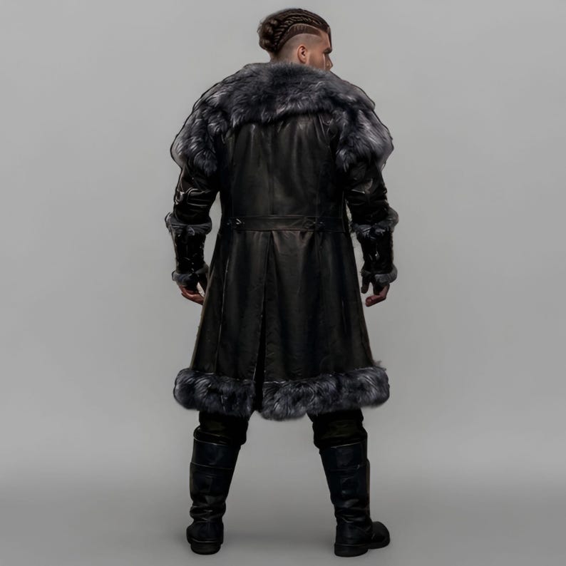 Black leather Viking armor costume with a long fur-trimmed medieval coat, sleeveless inner armor vest, layered leather panels, wide waist belt, fur-trimmed shoulders, long sleeves, adjustable straps, and matching leather leg armor. Rugged Norse-inspired outfit for men, ideal for Halloween, Viking cosplay, LARP, Renaissance fairs, medieval festivals, fantasy conventions, winter events, themed parties, and photoshoots. Handmade with custom sizing and customization options.