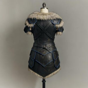 womens medieval leather armor, genuine leather cosplay set, dragon print chestplate, fur shoulder armor, blue trim armor dress, LARP viking warrior outfits, renaissance faire costume, fantasy armor for women, black leather body armor, adjustable buckle armor, handmade leather costume, gothic knight cosplay, historical reenactment gear, stage and theater armor, photography armor, custom size leather armor, dragon emblem armor, warrior queen outfit, faux fur shoulder pauldrons, layered skirt armor
