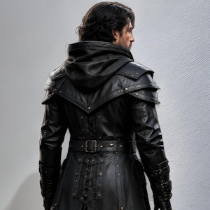 Black leather hooded warrior armor coat, dark gothic medieval fantasy outfit. Long silhouette with layered shoulder panels, attached hood, adjustable front buckles, detailed forearm sections, and full-length design. Genuine black leather, handmade, solid black color. Perfect for LARP, Renaissance fairs, Halloween cosplay, medieval festivals, photoshoots, stage performances, and themed events. Unisex medieval inspired warrior armor coat with strong tactical and fantasy warrior look.