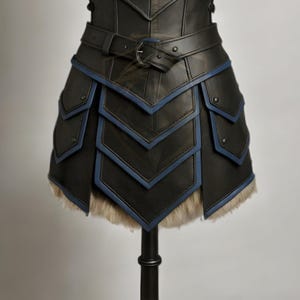 womens medieval leather armor, genuine leather cosplay set, dragon print chestplate, fur shoulder armor, blue trim armor dress, LARP viking warrior outfits, renaissance faire costume, fantasy armor for women, black leather body armor, adjustable buckle armor, handmade leather costume, gothic knight cosplay, historical reenactment gear, stage and theater armor, photography armor, custom size leather armor, dragon emblem armor, warrior queen outfit, faux fur shoulder pauldrons, layered skirt armor