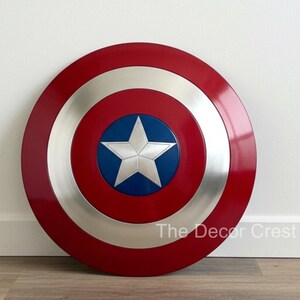 Captain America shield wall decor with red white blue rings and silver star, handmade metal superhero shield, Marvel inspired home decor