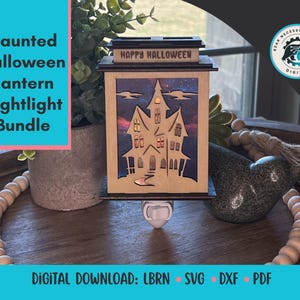May include: A wooden Halloween nightlight lantern with a haunted house design. The lantern has a rectangular shape with the words "HAPPY HALLOWEEN" on top. The image also includes the text "Haunted Halloween Lantern Nightlight Bundle".