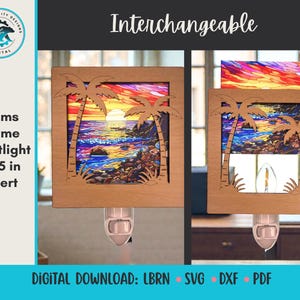 May include: Wooden nightlight frame with a palm tree design. The frame holds a colorful insert depicting a sunset over a beach. The nightlight insert is 3.5 inches. The text "Interchangeable" is at the top.