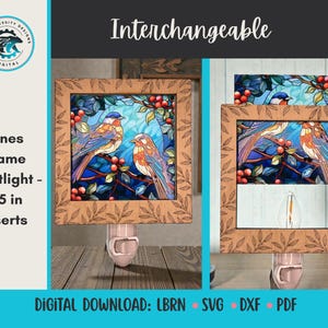 May include: A wooden frame nightlight with a stained glass design featuring two birds perched on a branch with red berries. The frame is 3.5 inches and has a leaf pattern. The word "Interchangeable" is at the top.