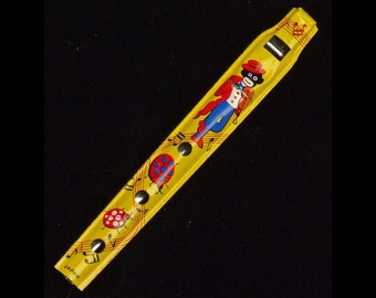 Jazz Man Carnival Tin Toy Penny Whistle Made in Japan Yellow Colorful Graphics Lady Bugs Musical Notes Rare Find