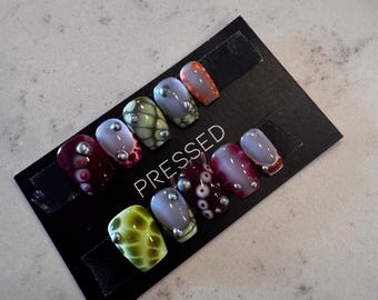 Blooming gel with French tips and silver charm