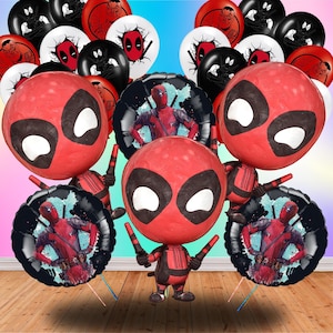 May include: A collection of Deadpool-themed party decorations, including red, black, and white balloons. The balloons feature Deadpool's mask and image. There are also foil balloons with Deadpool's image. The decorations are arranged on a wooden surface.