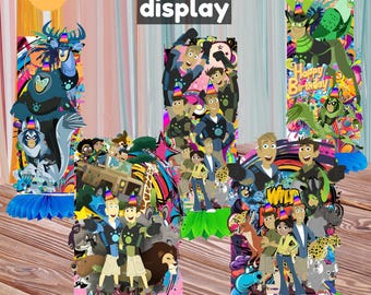 May include: A set of five honeycomb displays, each featuring colorful cartoon characters and the text "5pc Honeycomb display." The displays are approximately 15 cm tall and have green and blue paper bases. The displays are for a birthday party.