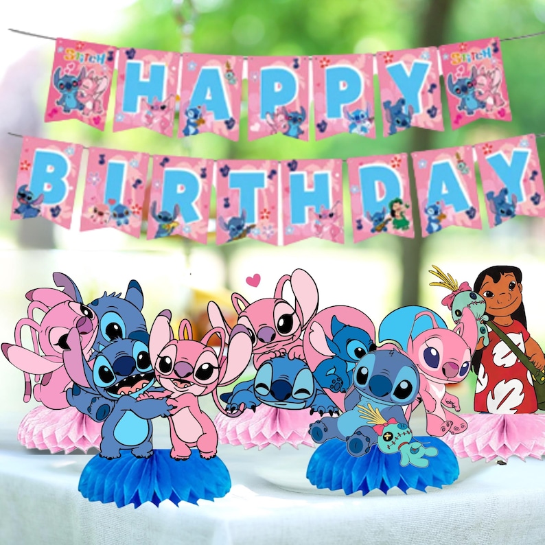 May include: A festive birthday party decoration set featuring a banner that reads "HAPPY BIRTHDAY" in blue letters on pink pennants. The set includes character cutouts of Stitch and Angel, with blue and pink honeycomb centerpieces.