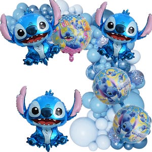 May include: A collection of blue foil balloons, including several shaped like the character Stitch, with large ears and a smiling face. Other balloons are round with Stitch graphics, and a variety of blue balloons create a festive display.