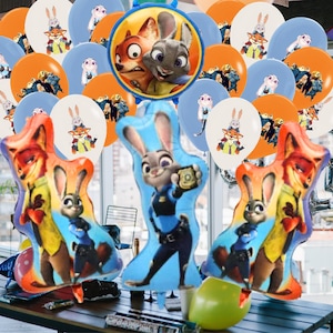 May include: A selection of Zootopia-themed party balloons. The set includes orange, blue, and white balloons, some with images of Judy Hopps and Nick Wilde. There are also foil balloons shaped like Judy and Nick.