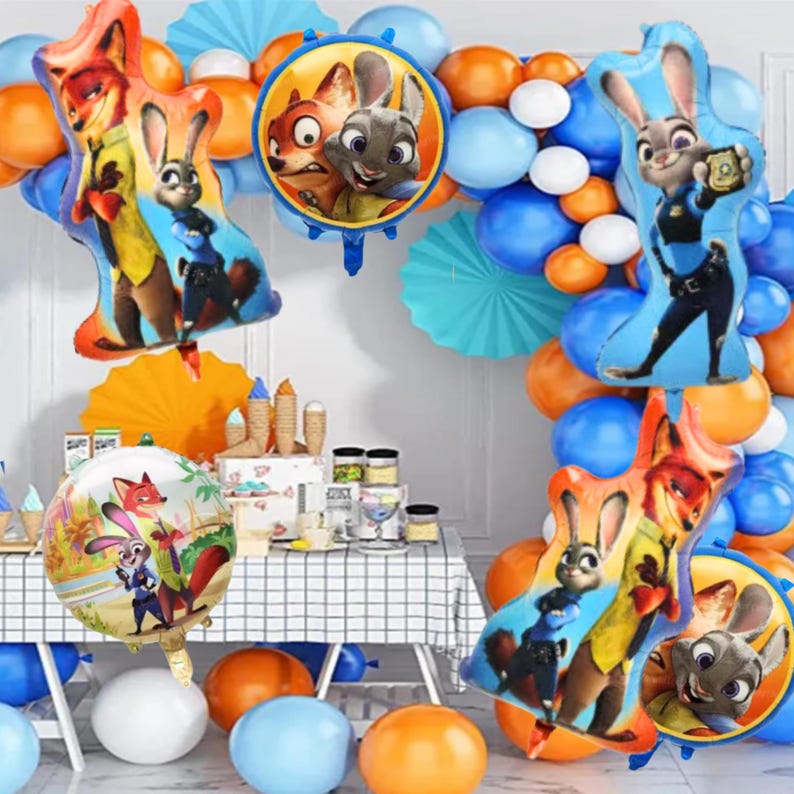 May include: A party scene with Zootropolis-themed balloons in orange, blue, and white. The balloons feature characters like Judy Hopps and Nick Wilde. The backdrop includes a table with party supplies, creating a celebratory atmosphere.