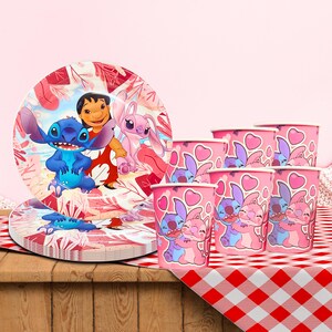 May include: A set of party supplies featuring characters from the animated film Lilo & Stitch. The set includes plates and cups with images of Stitch, Lilo, and Angel, in shades of pink, blue, and red.