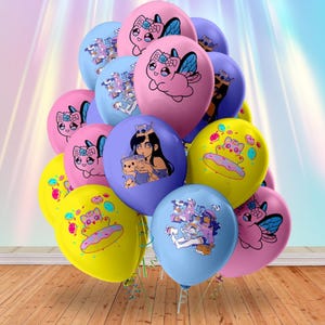 May include: A cluster of colorful balloons in shades of pink, blue, and yellow. Each balloon features a unique cartoon design, including a cat with wings, a girl with cats, and a cat on a donut. The balloons are tied together with green ribbons.