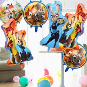 May include: A selection of Zootropolis-themed foil balloons in various shapes and sizes. The balloons display images of Judy Hopps and Nick Wilde. Some are character-shaped, others are round or oval.