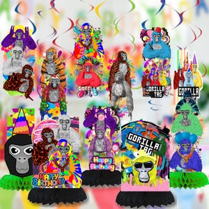 May include: A collection of colorful Gorilla Tag party decorations. The decorations feature cartoon gorillas in various outfits and poses, with text that says "Happy Birthday" and "Gorilla Tag". The decorations are on black honeycomb bases.