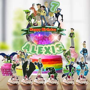 May include: A colorful birthday cake with a rainbow design, topped with character cutouts and the words "Happy Birthday ALEXIS". Cupcakes with character toppers are arranged in front of the cake. The number 7 is also included.