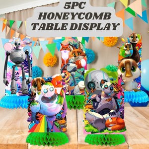 May include: A 5-piece honeycomb table display featuring colorful cartoon characters, including robots and animals. The display includes the text "5PC HONEYCOMB TABLE DISPLAY" and is decorated with a rainbow, butterflies, and a fox.