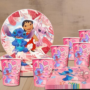 May include: A set of party supplies featuring characters from the animated film Lilo & Stitch. The set includes plates, cups, and napkins with pink and red floral designs and character illustrations. The cups and napkins have a pink background with hearts.