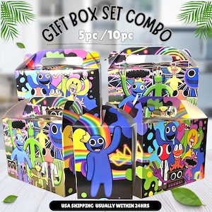 May include: Gift box set combo featuring colorful cartoon characters. The boxes have handles and are decorated with vibrant illustrations and the text "GIFT BOX SET COMBO 5pc/10pc". The boxes are on a light-colored surface.