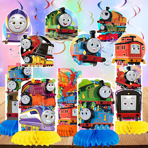 May include: A collection of colorful train-themed party decorations. The decorations feature various cartoon train characters in bright colors, including blue, green, red, and purple. Some decorations are on honeycomb bases, with blue and yellow accents. The overall theme is a children's birthday party.
