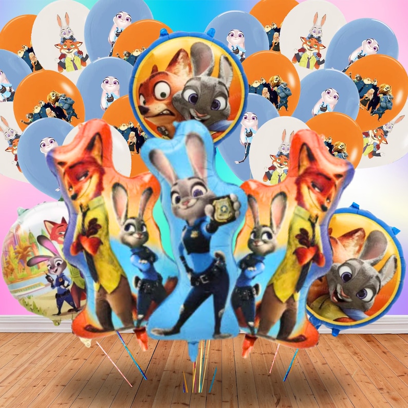 May include: A selection of Zootropolis-themed balloons in various shapes and sizes. The balloons feature images of Nick Wilde, Judy Hopps, and other characters from the animated film. The colour palette includes orange, blue, and white, ideal for a birthday party or themed event.
