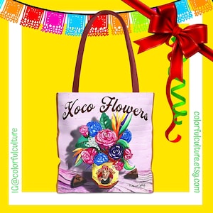 May include: A pink tote bag with the words "Xoco Flowers" printed on the front. The bag features a colorful illustration of a bouquet of flowers in a tin can with the words "Xocolatl" and "Kramer Gallery" printed on the bottom.