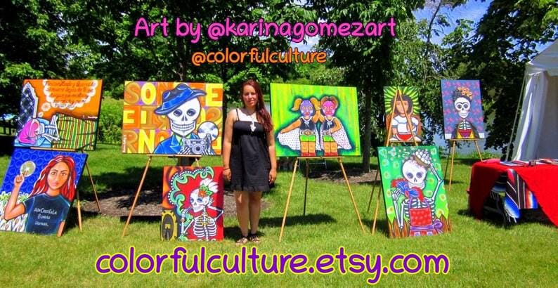 May include: A woman stands in front of a display of colorful paintings on easels. The paintings feature Day of the Dead imagery, including skeletons and flowers. The text "Art by @karinagomezart @colorfulculture" is at the top of the image. The text "colorfulculture.etsy.com" is at the bottom of the image.
