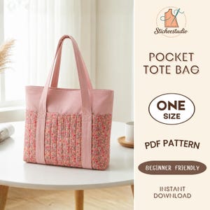 May include: A pink tote bag with two handles and a quilted floral fabric panel featuring small red, yellow, and blue flowers. The text on the right side reads Sticheestudio POCKET TOTE BAG ONE SIZE PDF PATTERN BEGINNER FRIENDLY INSTANT DOWNLOAD.