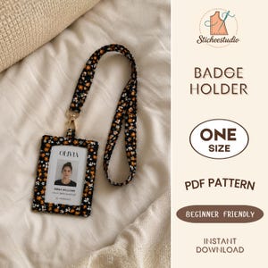 May include: A fabric badge holder with a matching lanyard featuring a black background with a small orange and white floral pattern. The holder contains a white ID card with the name Olivia Williams and the text Visual Merchandiser.