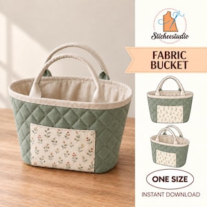 May include: A sage green quilted fabric bucket with two handles and a cream-coloured interior. The exterior features a rectangular front pocket with a small floral pattern. The text FABRIC BUCKET and ONE SIZE is visible on the right side.