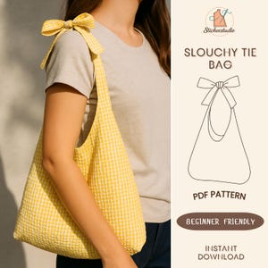 May include: A yellow and white gingham slouchy tie bag with a bow detail on the shoulder strap. The bag is made of a textured fabric and is being worn over the shoulder. The image also includes a graphic of the bag and text that reads "Slouchy Tie Bag, PDF Pattern, Beginner Friendly, Instant Download."